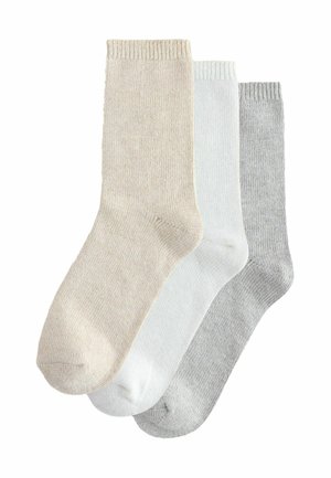 Three pairs of socks in beige, white, and gray. Made of soft fabric, featuring a ribbed cuff and a smooth texture throughout.