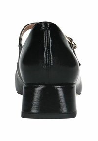 Schwarze Lackleder-Low-Heel-Schuhe mit runder Zehenpartie, verstellbarem Knöchelriemen und leichtem Glanz auf der Oberfläche.