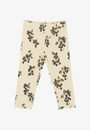 Leggings hechos de una tela suave, color crema, con un patrón de bayas y hojas en negro y verde. Cintura elástica; sin cierres o detalles visibles.