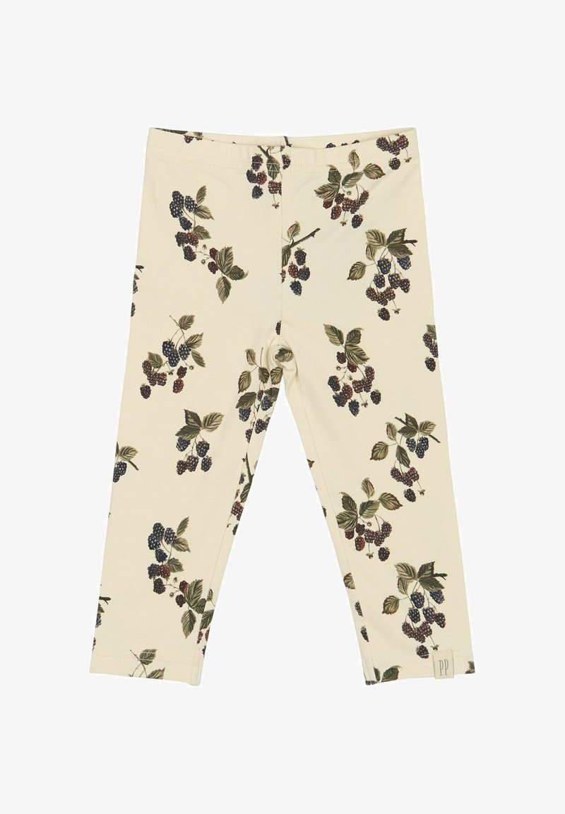 Leggings en tissu doux, de couleur crème avec un motif de baies et de feuilles noires et vertes. Taille élastique ; sans fermetures ni détails visibles.