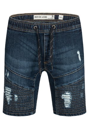 Pantaloni corti in denim blu scuro con vita regolabile tramite cordoncino, dettagli strappati e motivi texturizzati. Presentano cuciture a contrasto e design a più pannelli.