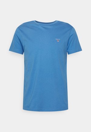 Blue cotton t-shirt with short sleeves, round neckline, and a small GANT logo on the left chest. Smooth texture and casual fit.