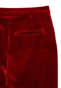 Red velvet trousers with a smooth texture, featuring a single back pocket and tailored fit. The fabric exhibits a rich, lustrous sheen.