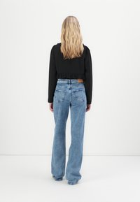 Noisy May NMYOLANDA - Wide leg - medium blue denim