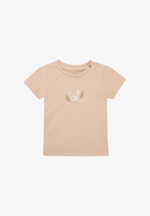T-shirt beige clair à manches courtes en coton doux, présentant un petit motif graphique sur le thème des plantes multicolore à l'avant et un bouton pression à l'épaule.