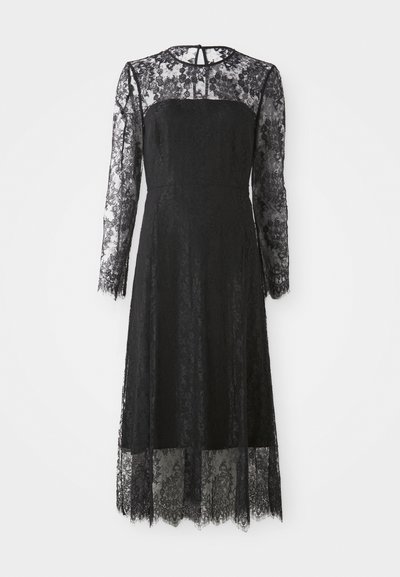 Μαύρο φόρεμα από δαντέλα με μακριά μανίκια, εφαρμοστή bodice και επενδεδυμένο λουλουδάτο σχέδιο. Μέσου μήκους με φινίρισμα σε δ scallop και λεπτομέρεια με κλειδαρότρυπα στην πλάτη.