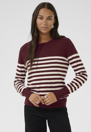 Pull bordeaux et crème à rayures avec de longues manches, un col rond et des poignets et un ourlet côtelés. Texture lisse, coupe décontractée.