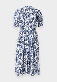 Navy blue gėlėta su baltais hibiscus ir lapų raštais suknelė. Siūlo aukštą apykaklę, pūkuotas rankoves ir pririštą juosmenį, kad būtų galima reguliuoti dydį.