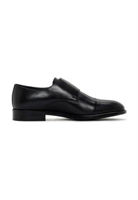 Zwart leren dresschoenen met een gladde afwerking, een lage gestapelde hak en een ronde neus. Voorzien van een instapontwerp met subtiele stiksels.