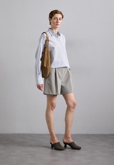 Light blue and white striped button-up shirt, gray tailored shorts, brown suede shoulder bag, and brown woven slip-on shoes with a small heel.