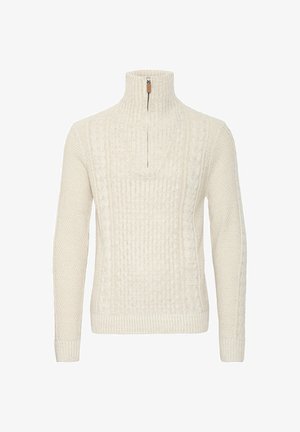 Kremno barvana pletena brezrokavnica z visokim ovratnikom in četrtinsko zadrgo. Opremljena je s teksturiranimi vzorci ter rebrastimi zapestji in robom.