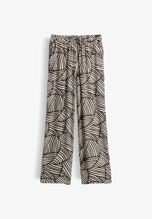 Locker sitzende Hose mit schwarzem und weißem abstraktem Blattmuster und Kordelzugbund, flach auf weißem Hintergrund dargestellt.