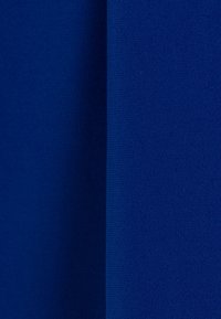 Blue fabric with a smooth texture, featuring two sections that display a consistent color and weave pattern. Lightweight and uniform appearance.