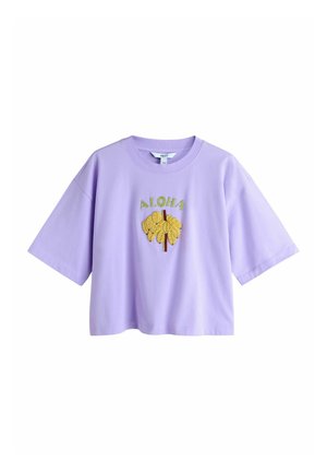 Lilac short-sleeve cropped t-shirt with yellow banana graphic and green "ALOHA" text on chest.
