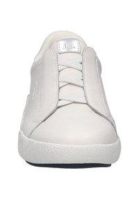 White leather sneaker with a smooth finish, featuring a lace-up front and textured rubber sole. Includes a silver logo accent on the tongue.