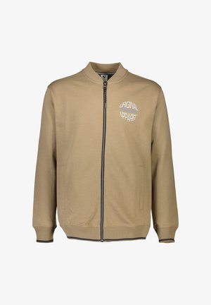 Beige Reißverschlussjacke mit hohem Kragen, Rippbündchen und Saum. Mit blau-weißer "Original Apparel" Grafik auf der Brust und Seitentaschen.