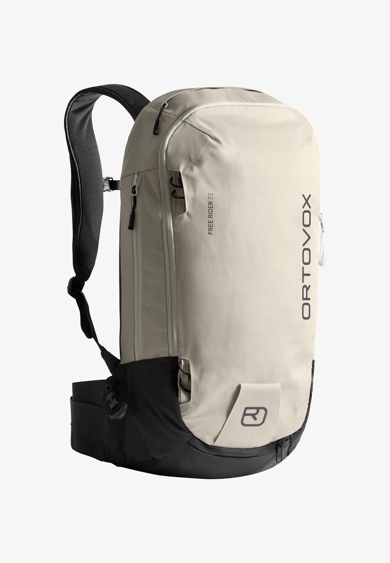 Hellbeige und schwarze Ortovox Freerider 22 Rucksack mit gepolsterten Trageriemen, mehreren Reißverschlussfächern und verstellbarem Hüftgurt.