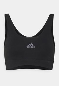 Juodas sportinis liemenukas, pagamintas iš tamprios medžiagos, su apvaliu kaklu, platesnėmis petnešomis ir pilku "Adidas" logotipu priekyje. Sklandus paviršius.