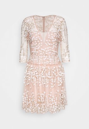 Short-sleeved blush dress featuring a V-neck, floral embroidery, and layered tulle skirt with a slightly sheer finish.