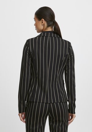 Black and cream striped blazer with a tailored fit, featuring long sleeves, notched lapels, and a smooth fabric texture.
