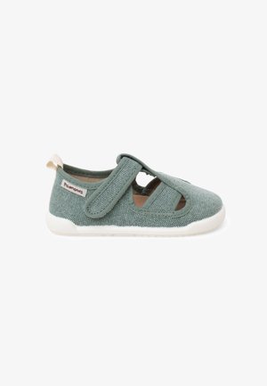 Chaussure verte pour tout-petit avec texture en tissu, semelle blanche en caoutchouc, et une seule bride Velcro sur le dessus pour la fermeture.