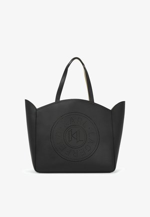 Must must nööriga naha käekott, millel onustega perforeeritud ümmargune logo, lame ülaosa ja kaks käepidet. Sile tekstuur ja struktureeritud kuju.