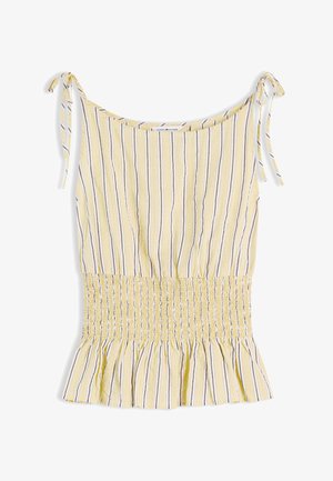 Haut sans manches jaune avec des rayures verticales blanches, grises et beiges, taille froncée, ourlet à volants et bretelles à nouer sur les épaules.