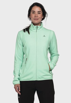 Light mint green fleece jacket with a high collar, front zipper, side pockets, and a subtle logo on the chest. Smooth texture.
