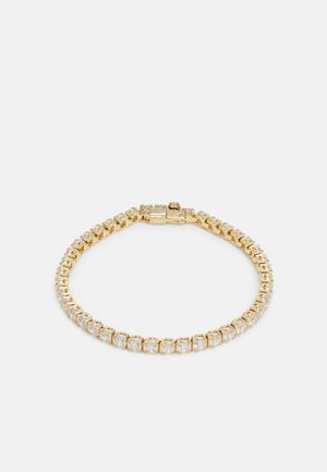 Bracciale in tonalità oro con cristalli trasparenti rotondi incastonati in un design flessibile e intrecciato, dotato di una chiusura sicura. Finitura liscia e lucida.