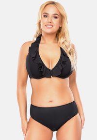Set di bikini nero con top a collo alto e rifiniture a volant, dal décolleté profondo. La parte inferiore a vita alta offre una copertura completa.