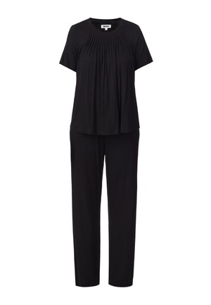 Ensemble noir deux pièces avec haut plissé à manches courtes et pantalon droit, présenté sur un fond blanc, marque DKNY visible sur le col.