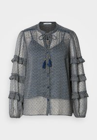 Διάφανη μπλε μπλούζα με σχέδιο, με ρυάκια στα μανίκια, κορδόνια στο λαιμό και κουμπιά για κλείσιμο. Περιλαμβάνει περίπλοκο γεωμετρικό σχέδιο σε φωτεινότερες αποχρώσεις.