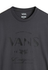 Gray cotton t-shirt with a crew neck. Features bold, faded black "VANS" logo, decorative text, and an intricate design element below.