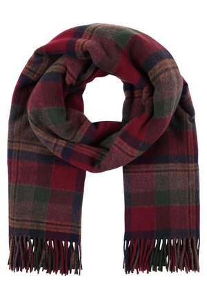 Écharpe en laine à carreaux rouges, verts et bruns avec des extrémités effilochées, pliée en forme circulaire de manière lâche.