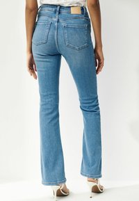 Next SUPER SOFT STANDARD  TALL - Vaqueros bootcut - mid blue wash