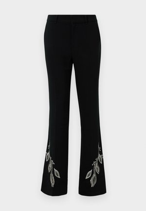 Pantalons évasés noirs avec broderie décorative de feuilles argentées au bas. Caractéristiques d'un tissu lisse, d'une coupe ajustée et d'un design à l'avant plat.