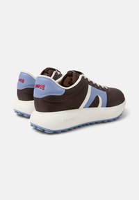 Brown and blue athletic shoes with a white sole, displaying the "Camper" logo on the heel and a wavy design on the sides.