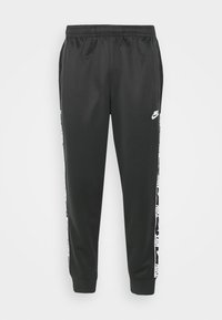 Musta collegehousut, joissa on joustava vyötärönauha, valkoinen Nike-logo ja kuvioidut sivuraidat. Valmistettu sileästä, kevyest ä kankaasta.