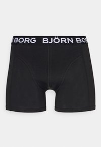 Schwarze Boxershorts aus weichem Stoff, mit einem breiten elastischen Bund, auf dem der Markenname "BJÖRN BORG" in kontrastierenden weißen Buchstaben steht.