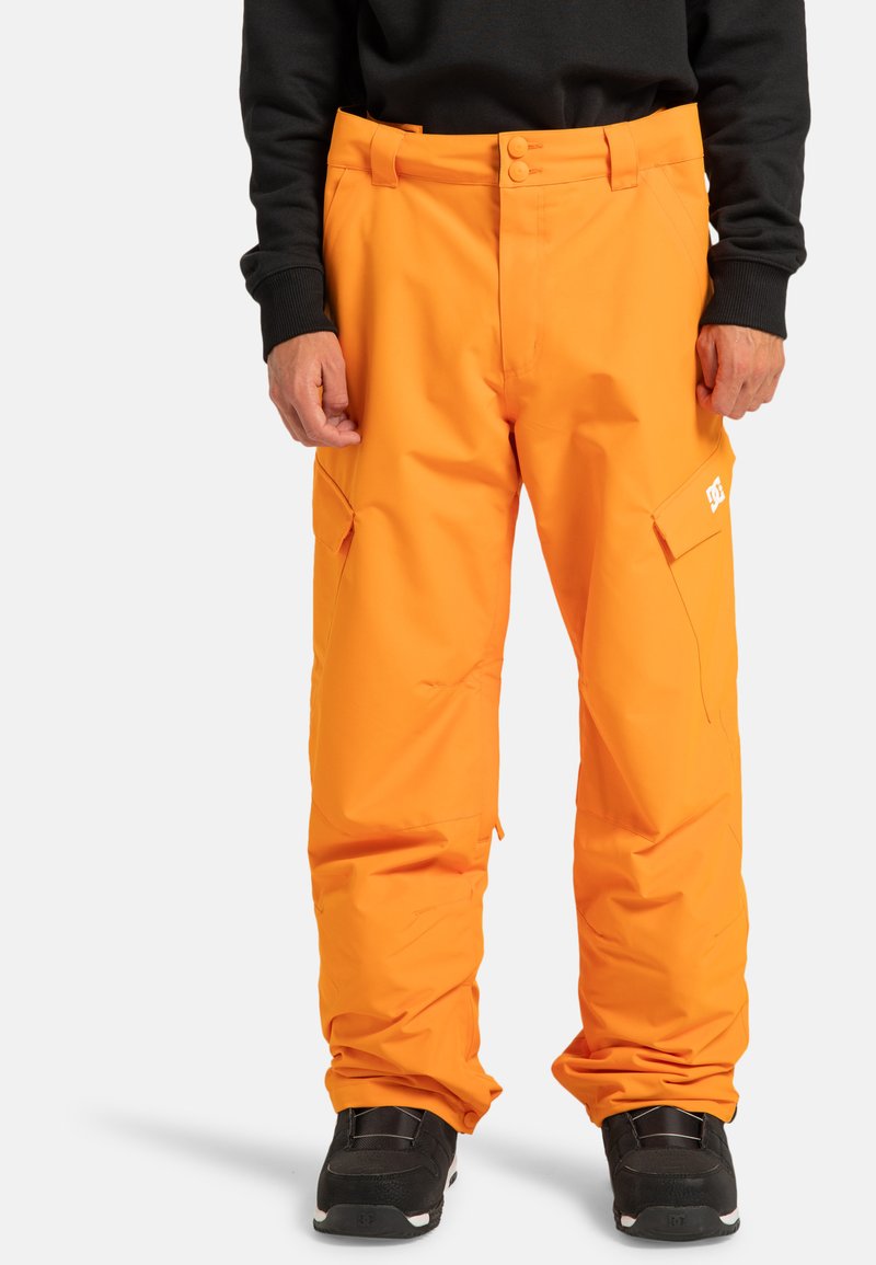 Felroestkleurige waterdichte sneeuwbroek met een relaxte pasvorm, voorzien van twee zijzakken, een knoopsluiting en logo-details op het been.