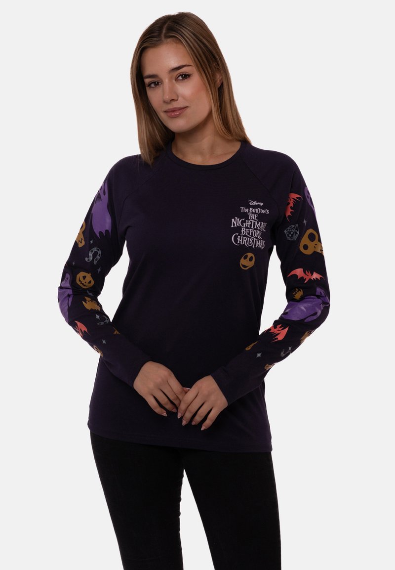 Purple long-sleeve shirt featuring "The Nightmare Before Christmas" graphic. Sleeves adorned with Halloween-themed patterns like pumpkins and ghosts.