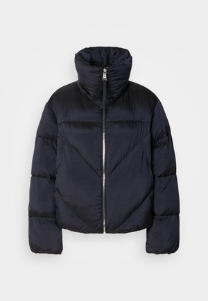 Puffer jacket in dark navy with high collar, featuring a metallic zipper and diagonal seam detailing. Made from lightweight, shiny fabric.