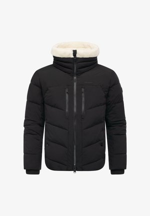 Zwarte pufferjas met een kraag gevoerd met fleece, twee borstzakken met rits, een ritssluiting aan de voorkant en geribbelde manchetten. Heeft een doorgestikt design.