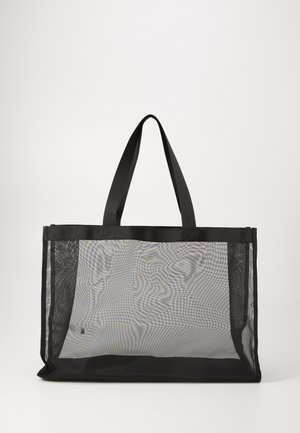 Sac fourre-tout en maille noire avec des poignées en tissu solides, de forme rectangulaire et à corps transparent, idéal pour transporter divers objets.