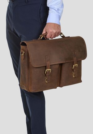 Brown leather briefcase with a flap, dual front buckles, and golden hardware. Smooth texture, carried by hand.
