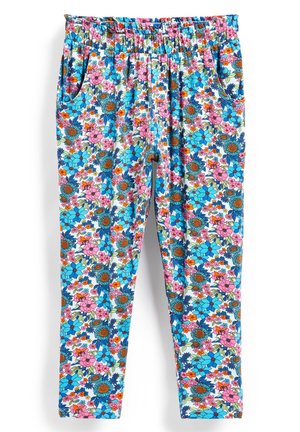 Pantalon à taille élastique avec poches latérales présentant un motif floral coloré en bleu, rose, orange et vert sur fond blanc.