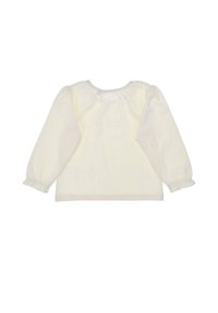 Long-sleeve, cream blouse with a round neckline, gathered shoulders, and elasticized cuffs, made of soft fabric.