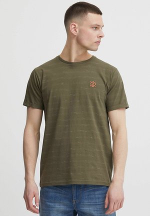 Olive green t-shirt with subtle horizontal stripe pattern, crew neck, short sleeves, and small orange graphic logo on the chest.