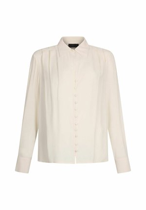 Langärmlige Bluse in hellem Creme mit Knopfleiste, klassischem Kragen und dezenten Falten an den Schultern. Sanfte, glatte Stofftextur.