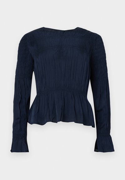 Blusa blu navy a maniche lunghe con dettagli arricciati, orlo a peplo e tessuto strutturato. Presenta una scollatura rotonda e maniche svasate.